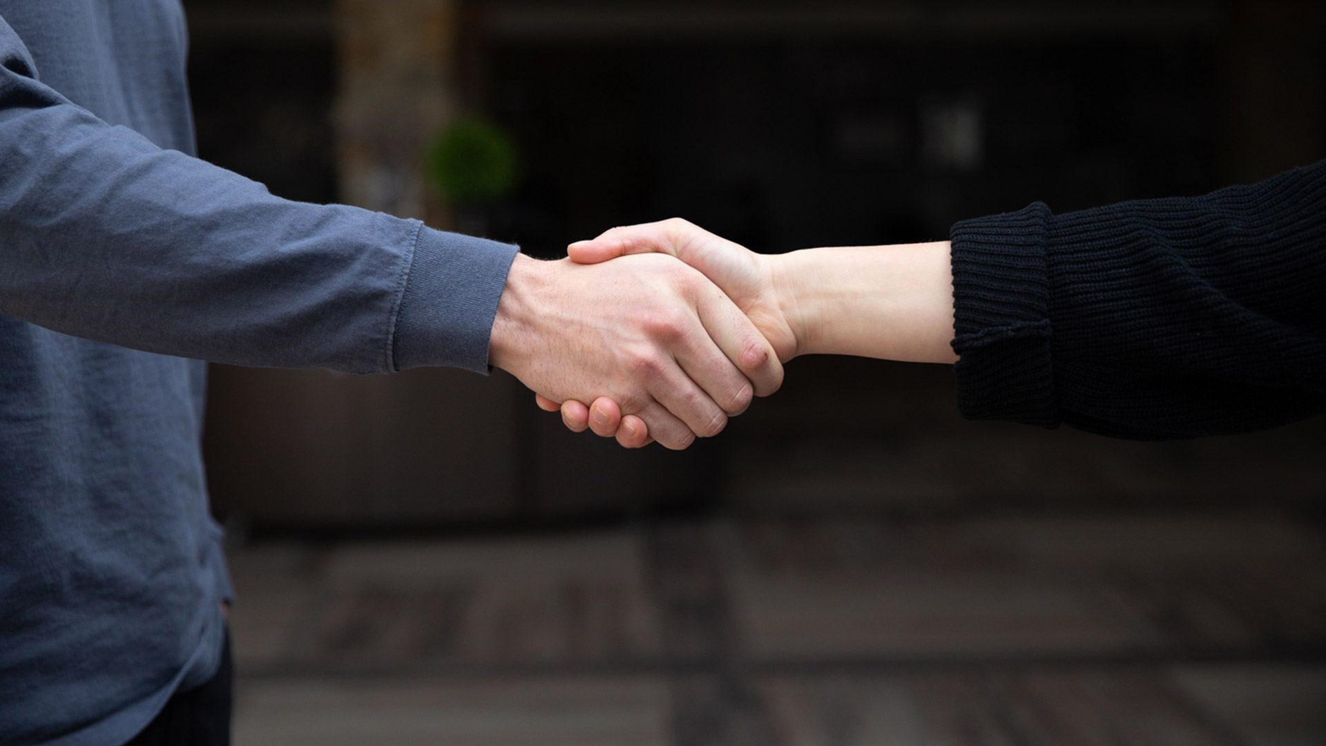 A woman and man shaking hands. PEP supports and educates families dealing with the effects of substance use and addiction in loved ones.